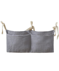 NewLuyer bedside hanging bag on crib setup for quick access to diapers and bottles.