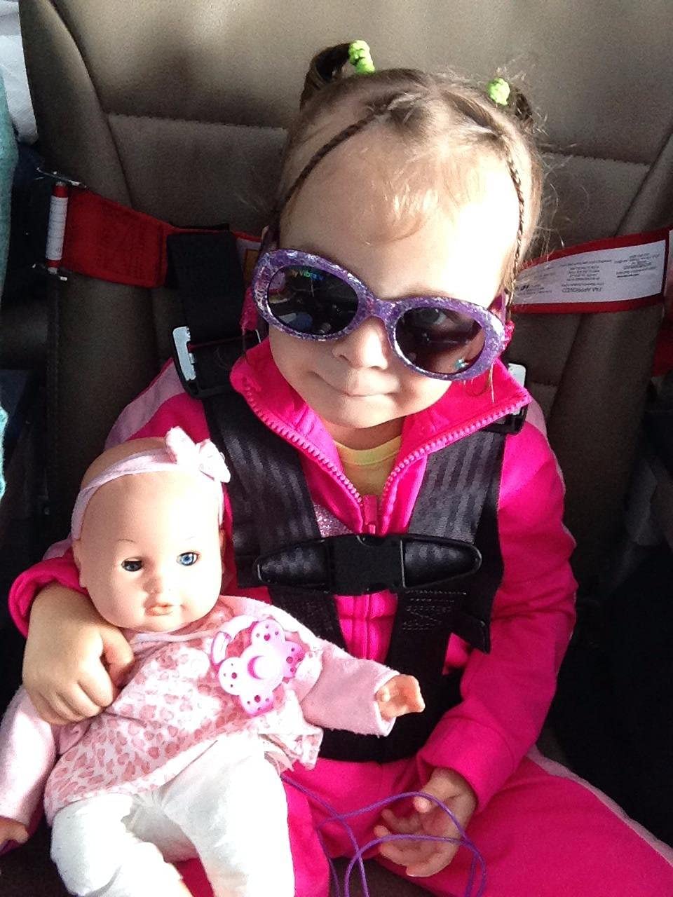 Newroutes Child Airplane Safety Harness in use on a plane with secure restraint.