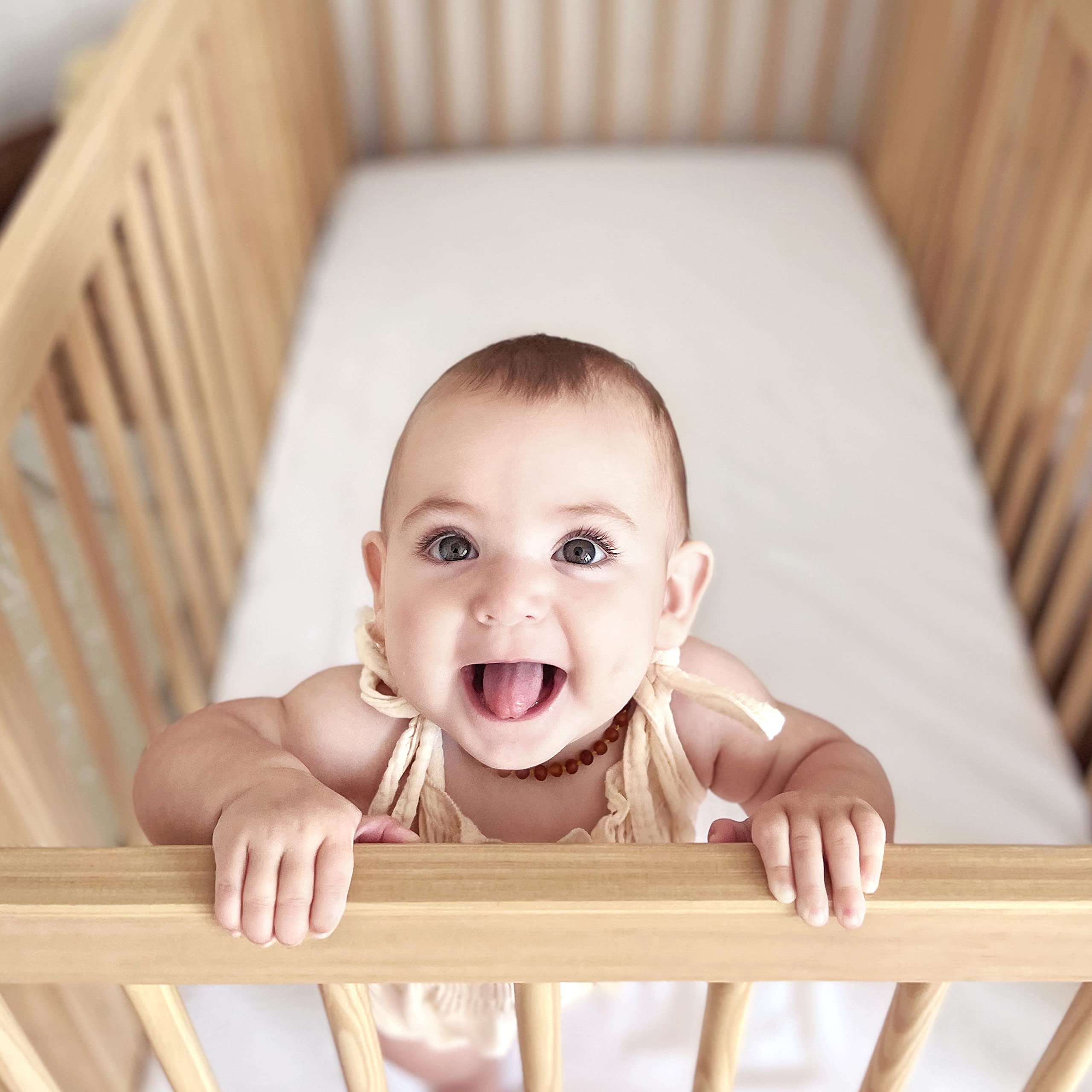 Newton Baby elastic all-around edge keeps sheet snug on mattress