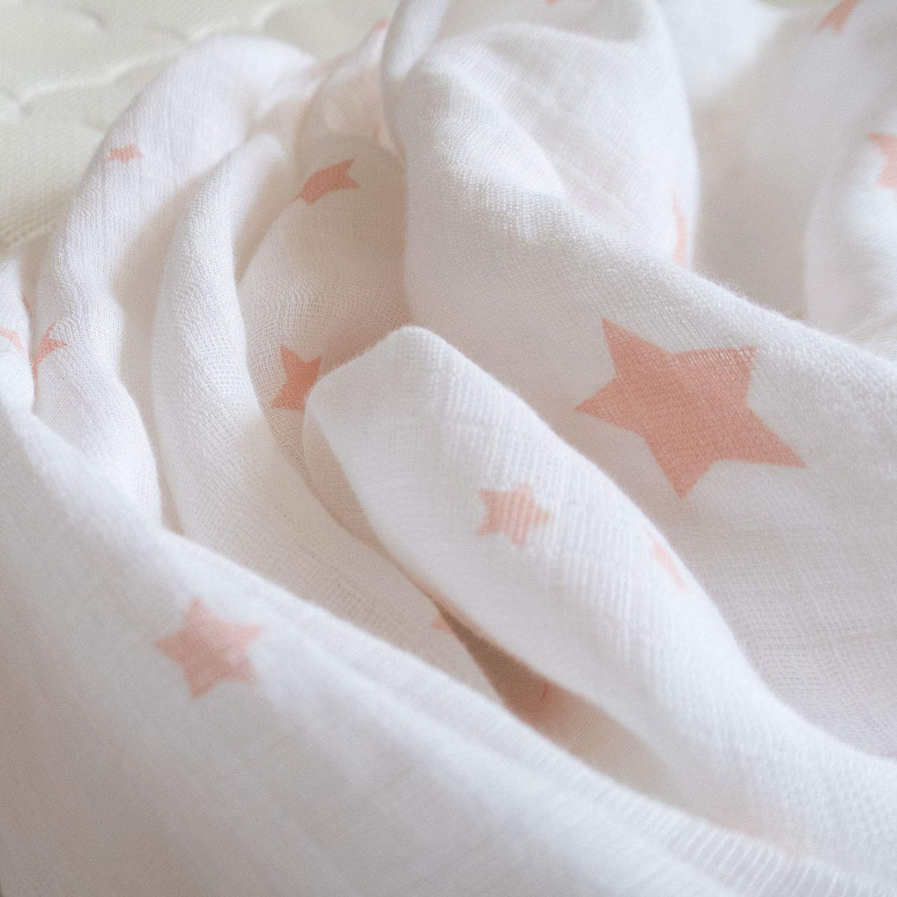 Newton Baby elastic-fit view showing snug, secure mini crib mattress compatibility