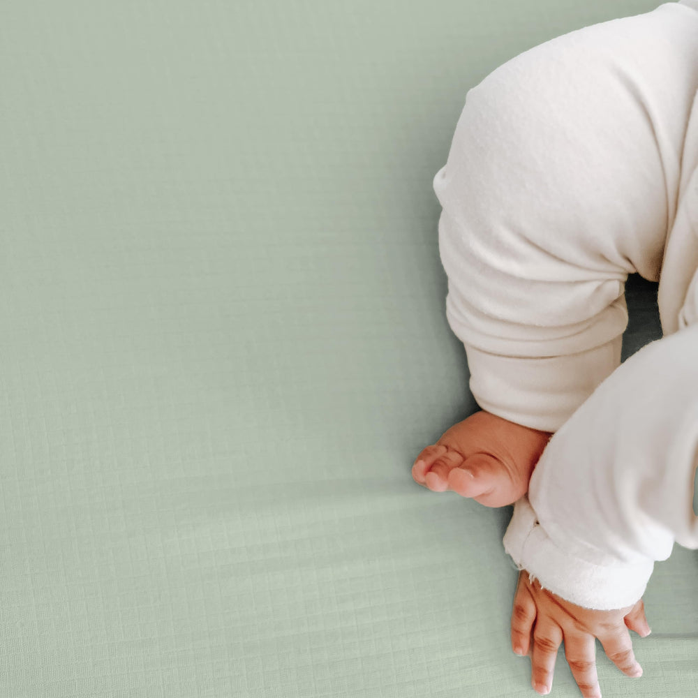 Newton Baby GOTS-certified crib sheets emphasize eco-friendly production and safe baby materials.