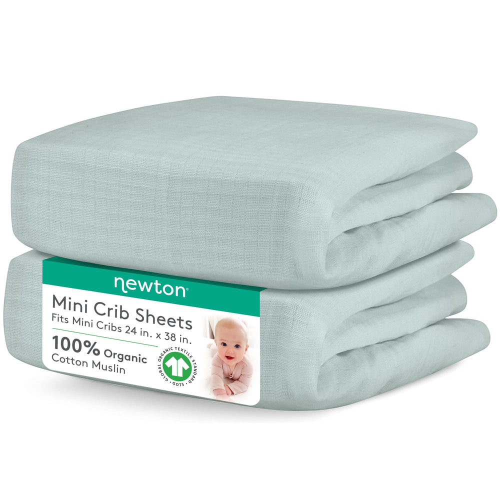 Newton Baby sage mini crib sheets close-up highlighting breathable organic muslin for baby comfort.