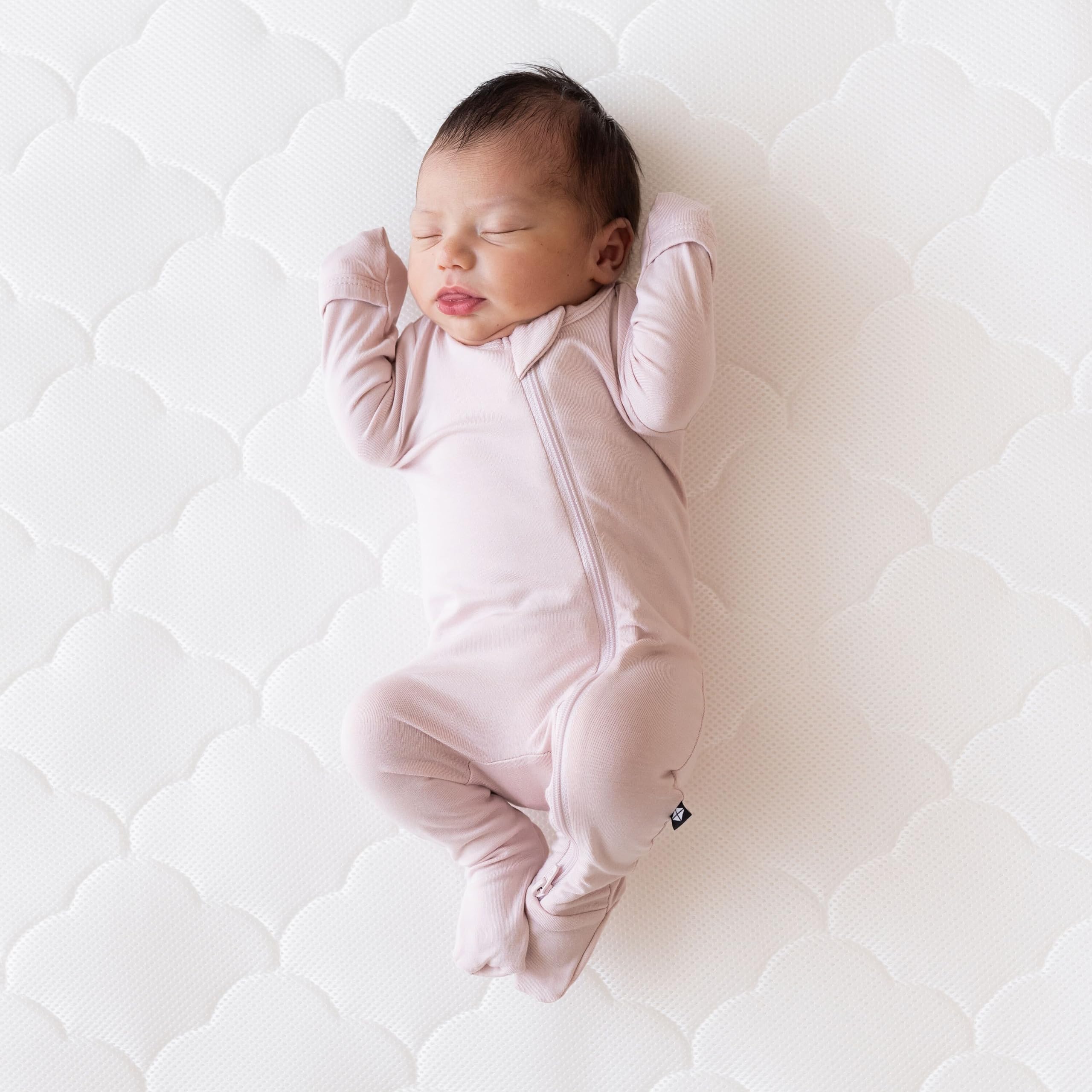 Newton Baby spare cover is machine washable to simplify busy nursery days.