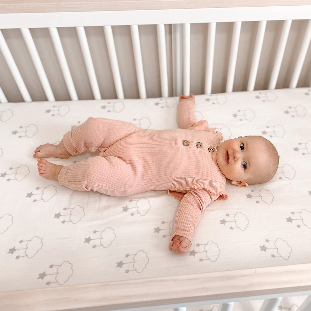 Newton Baby two-pack sheets ready for laundry rotation, staying clean between washes.
