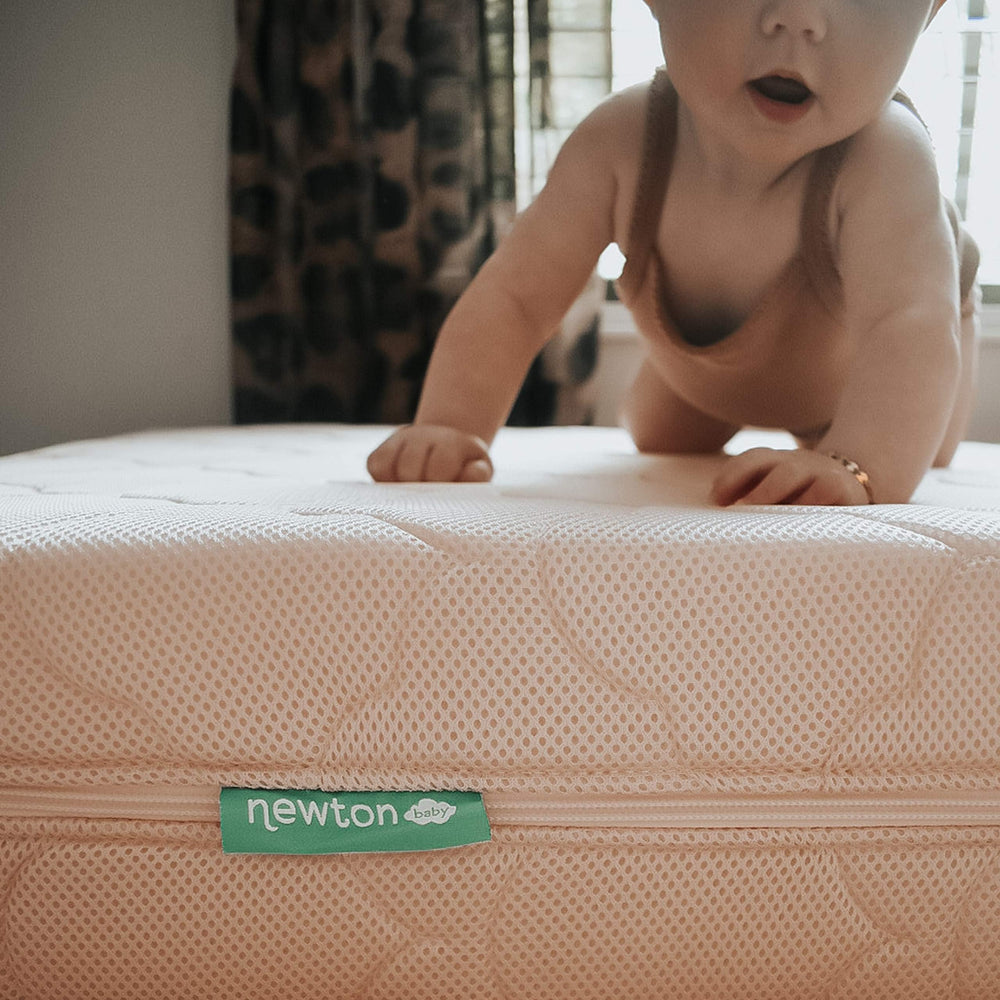 Newton Baby Waterproof Extra Cover care: machine wash cold, tumble dry low.