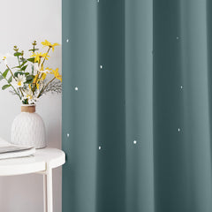 NICETOWN star cut out curtain fabric texture shows triple weave blackout for better privacy.