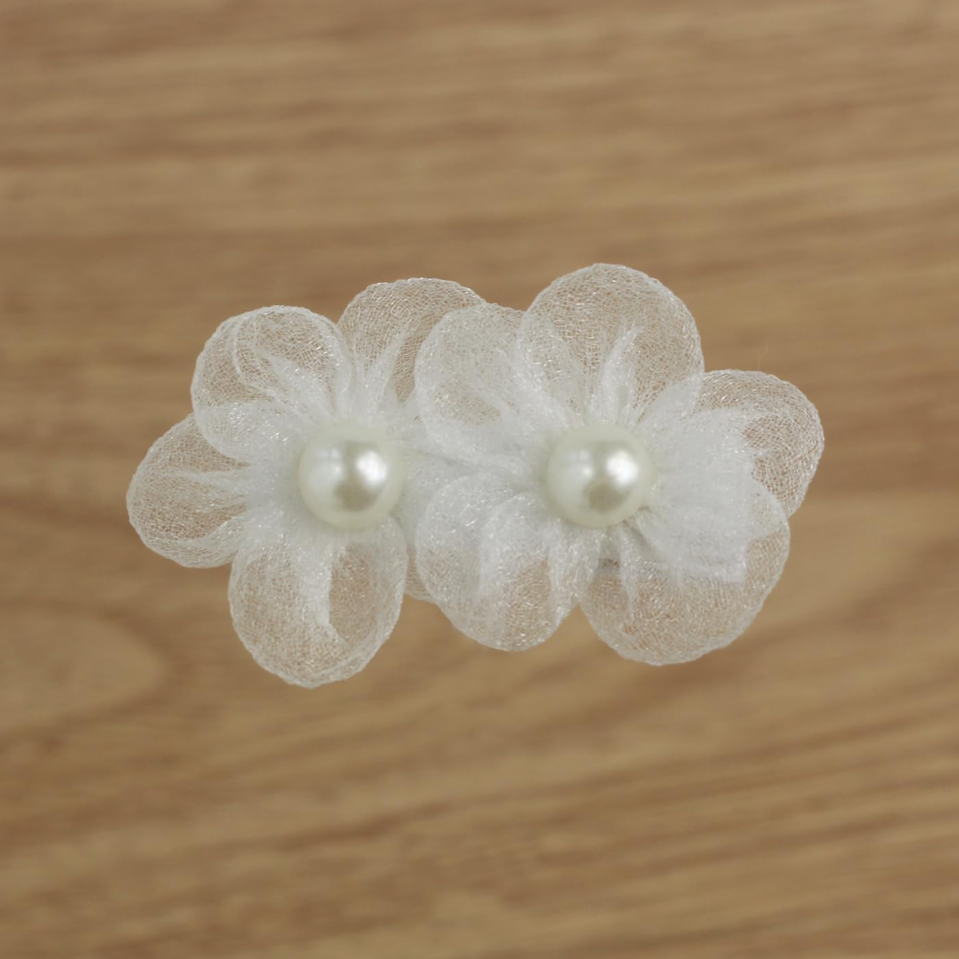 Nihao Baby baptism-friendly clip securing delicate toddler hair during ceremonies