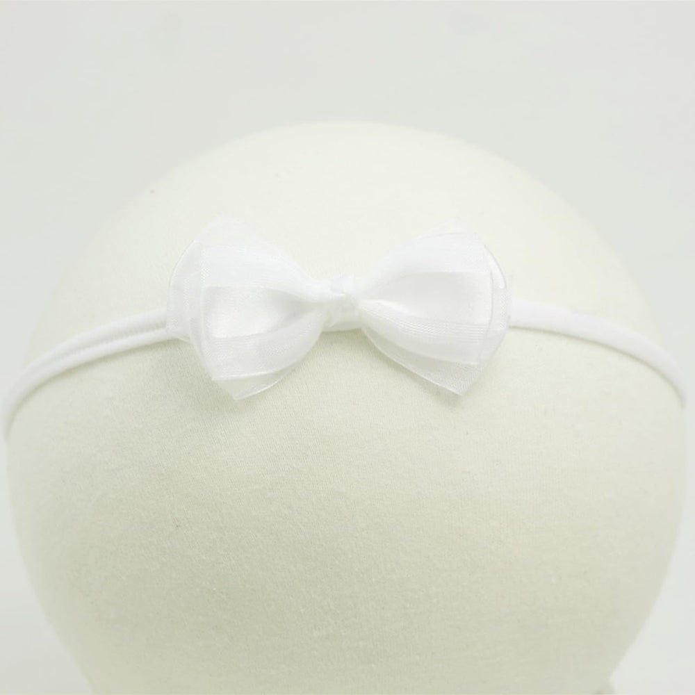 Nihao Baby one-size headband fits most infants for simple everyday styling.