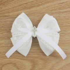 Nihao Baby lace bow on hair for christening look.