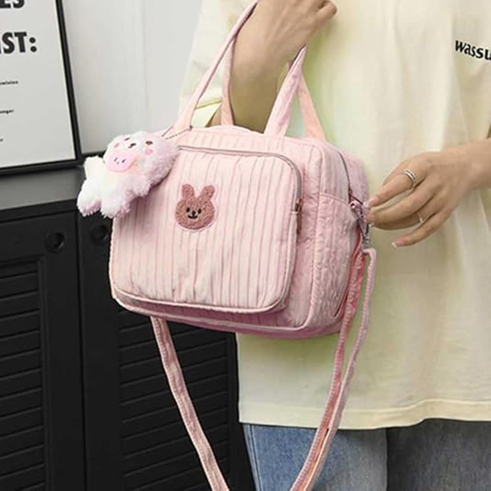 NIKUKY diaper bag tote converts from shoulder to crossbody for versatility