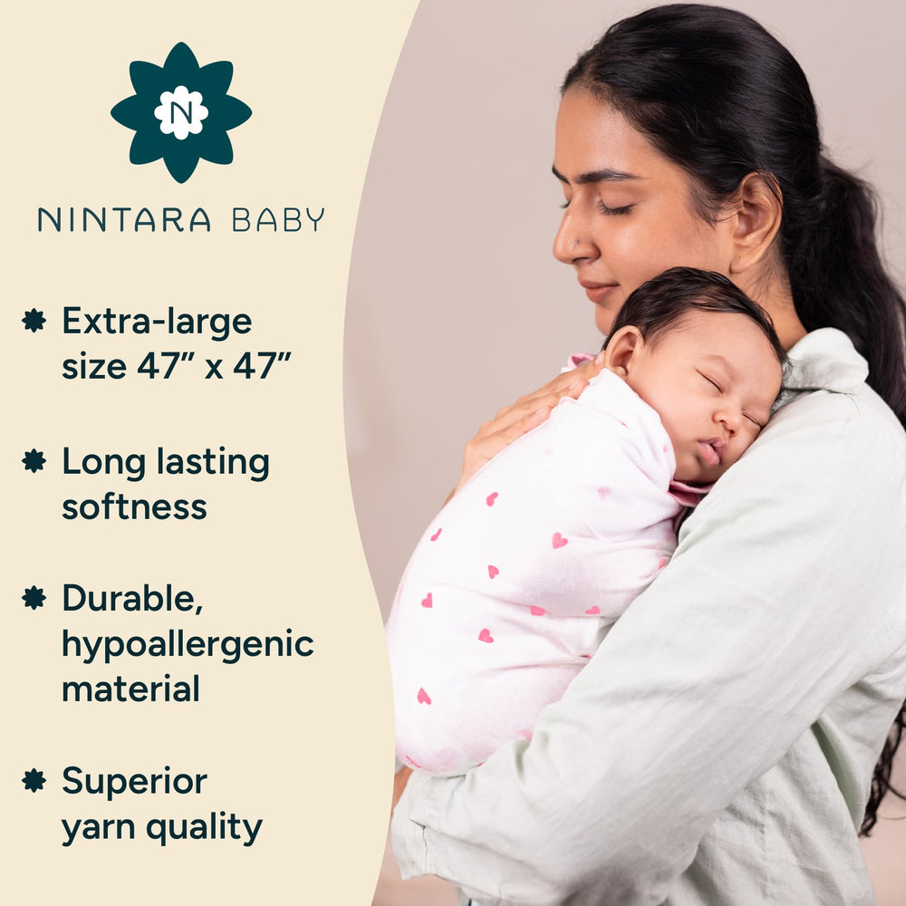 NINTARABABY swaddle Pink Blossom in use, gentle warmth for cozy newborn snuggles.
