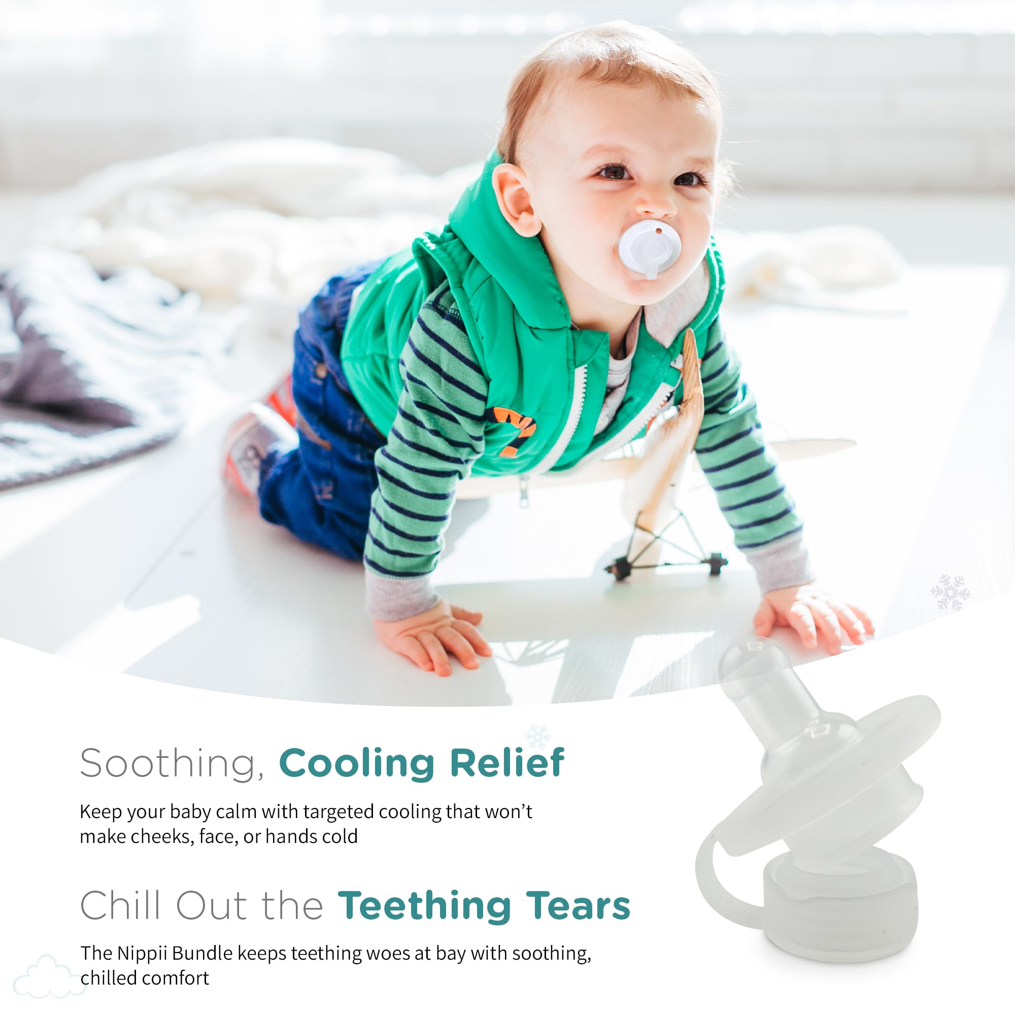 Nippii baby using cooling relief during teething playtime.
