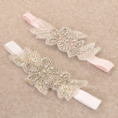 Nishine baby headband with elastic band, secure fit for everyday wear and special occasions.
