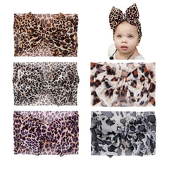 Nishine leopard headwrap featuring a knotted bow for everyday outfits.