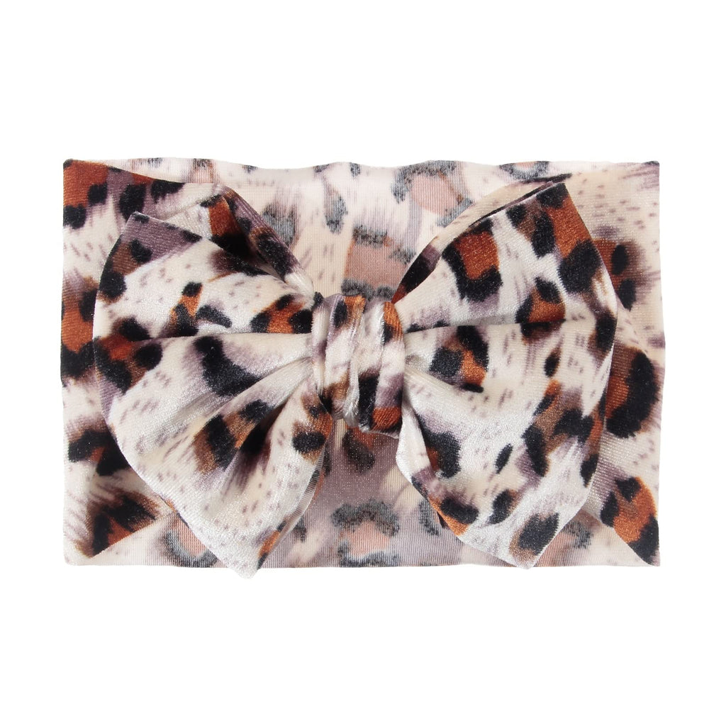 Nishine leopard headwrap in a photography setup for stylish portraits.
