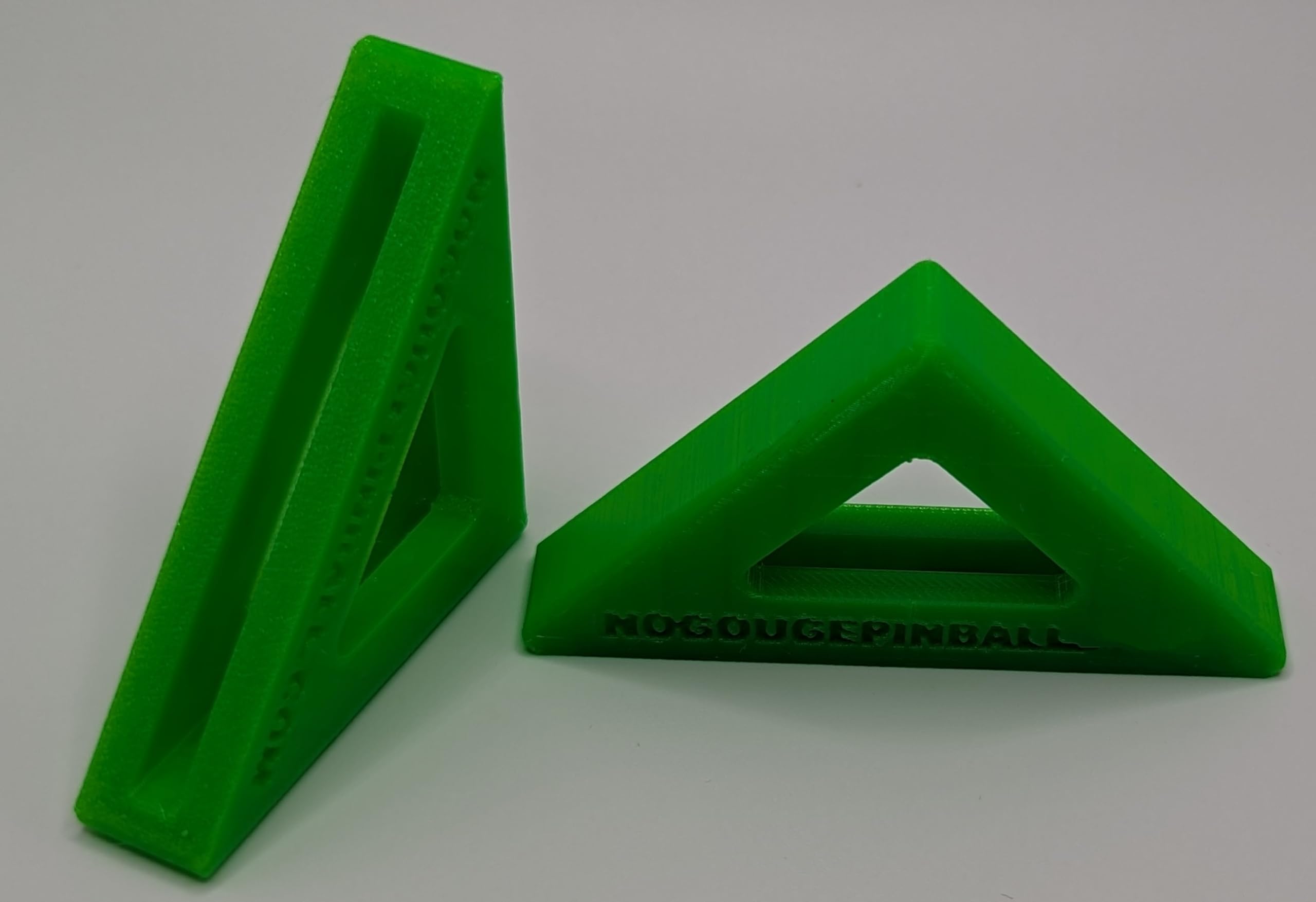 No Gouge Pinball neon green corner protector guards glass edges with vibrant color.