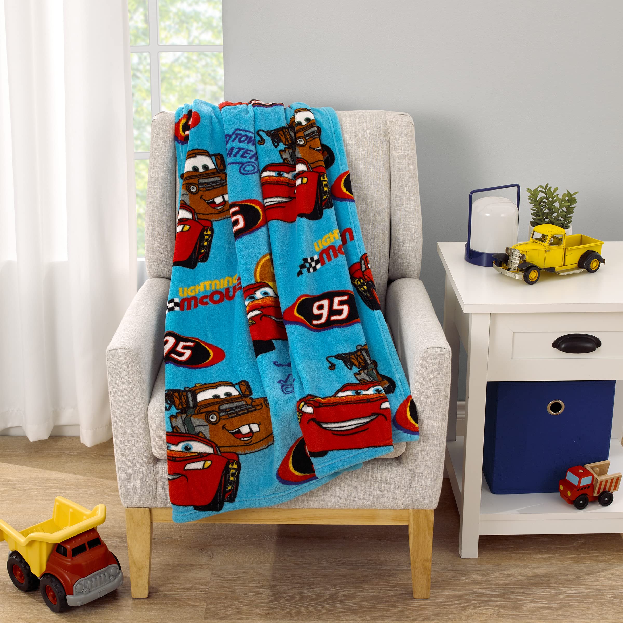 NoJo Disney Cars Radiator Springs blanket vivid blue red design ideal playtime.