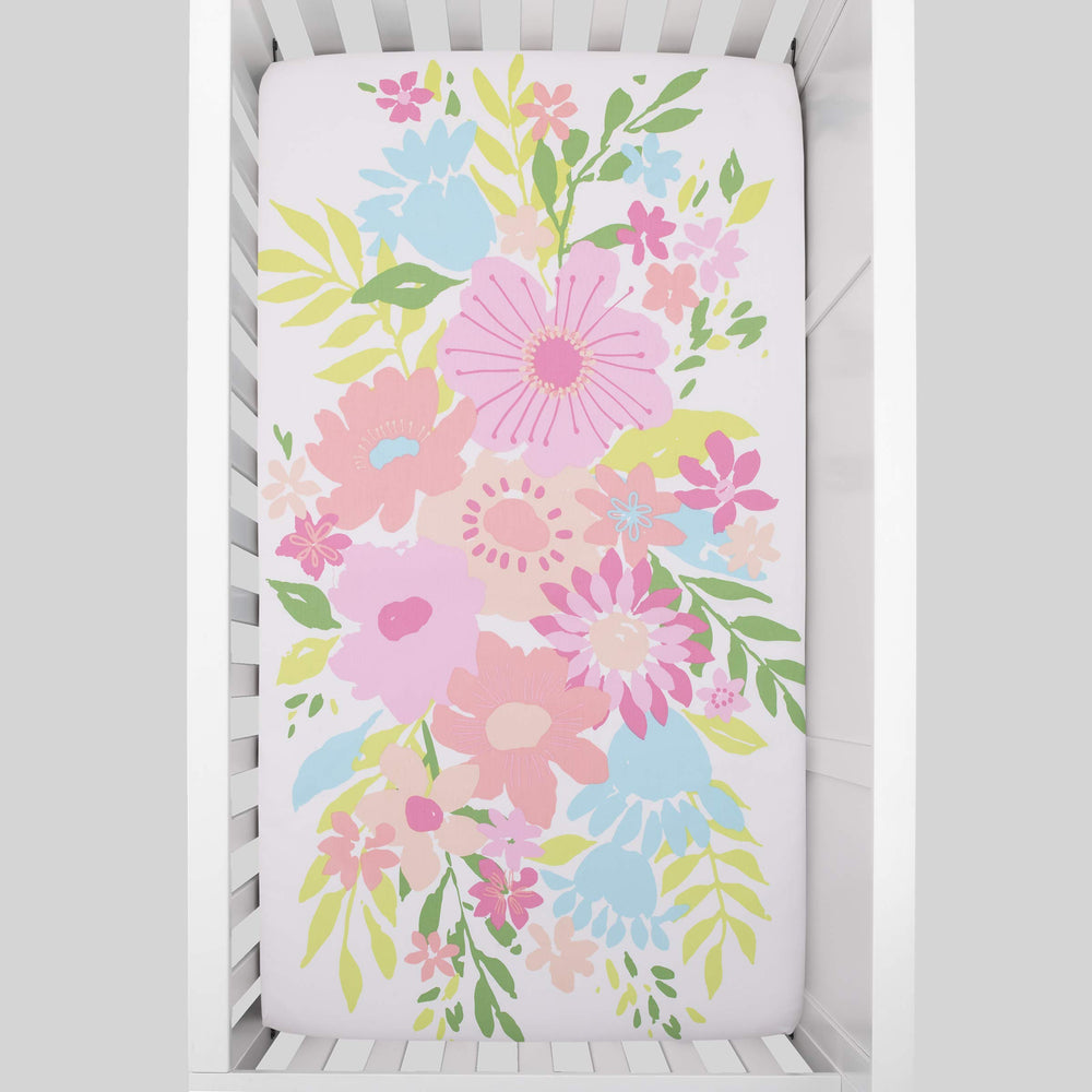 NoJo Floral Burst elastic edge—snug fit around standard crib mattresses for tidy sleep spaces.