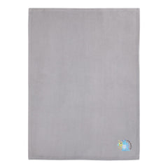 Gray turquoise green colorway complements nursery decor with a friendly character vibe