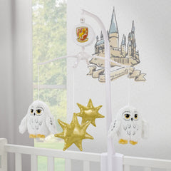 NoJo golden stars adorn the mobile create calming ambience.