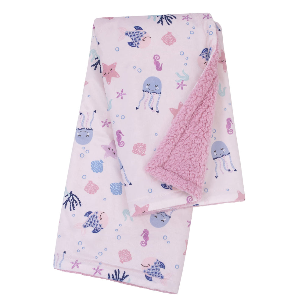 NoJo blanket showcases pink and blue sea creatures for on-the-go comfort.