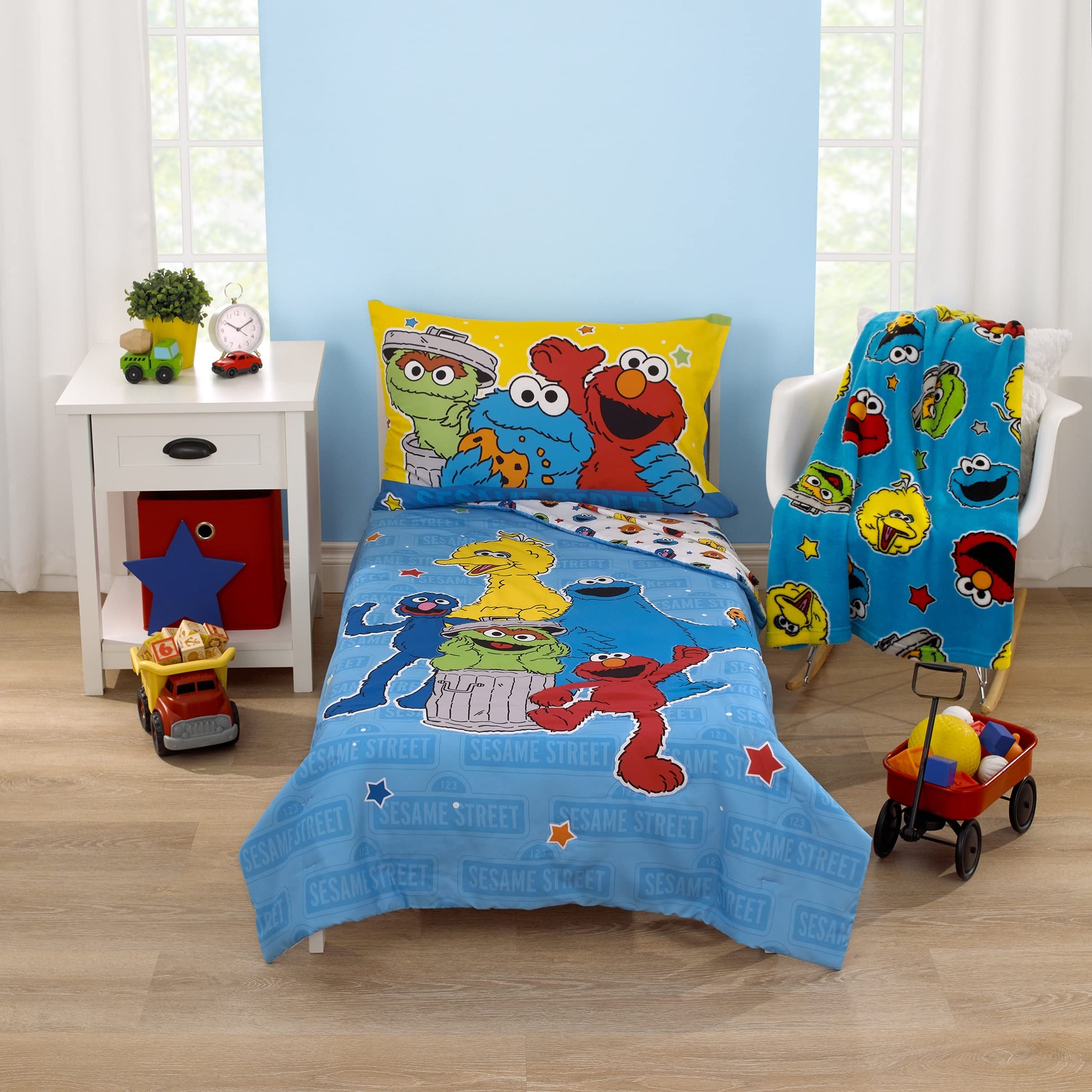 NoJo Sesame Street Come and Play blanket in bright blue, green, red, yellow.