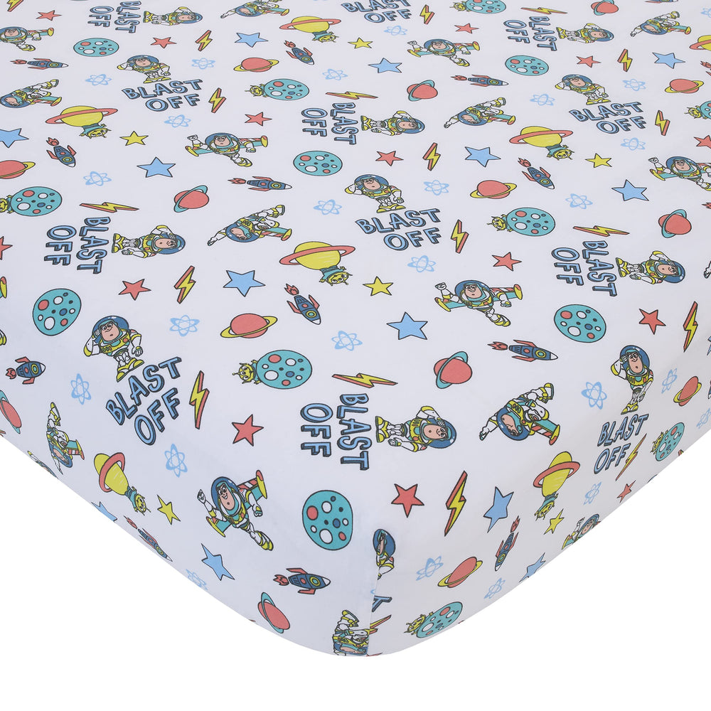NoJo Buzz Lightyear countdown text on crib skirt adds playful detail.