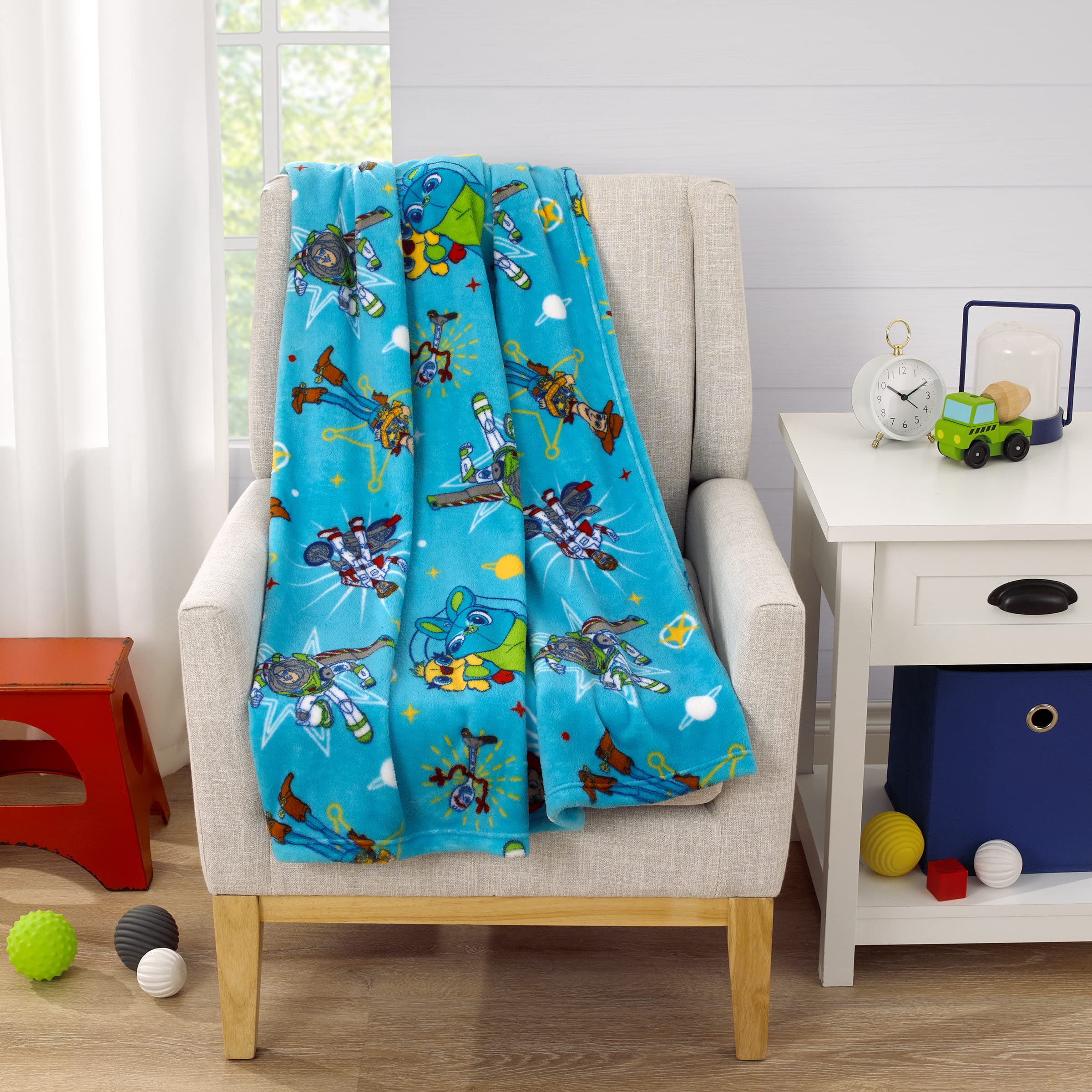 NoJo Disney blanket blue-green-yellow pattern, vibrant for bedtime and playtime