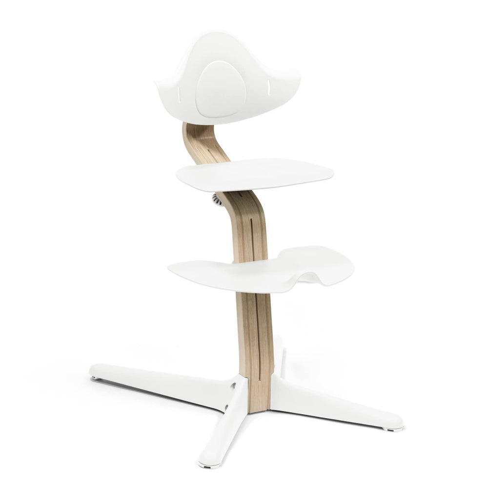 Nomi chair by Stokke, setup angle view shows easy family table seating