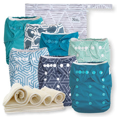Nora's Nursery 7-pack cloth diapers in Dimensional Blues with adjustable fit.