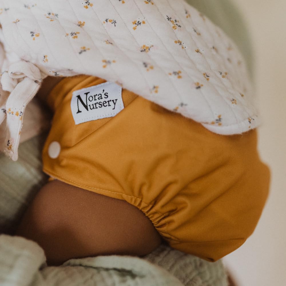 Nora's Nursery adjustable snaps fit growing babies from 10 to 35 lb