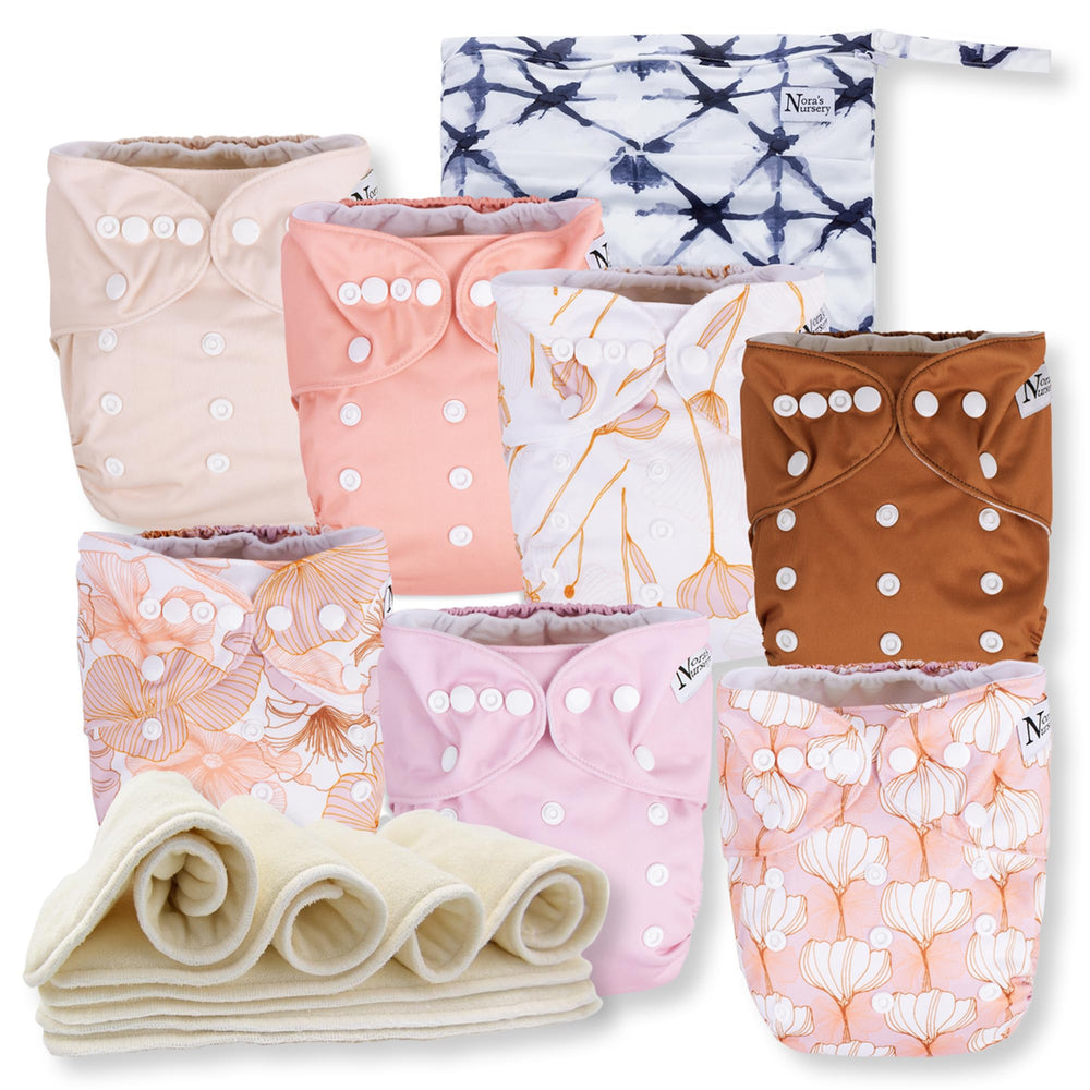 Nora's Nursery cloth diaper 7-pack with adjustable snaps for a versatile newborn-to-toddler fit.