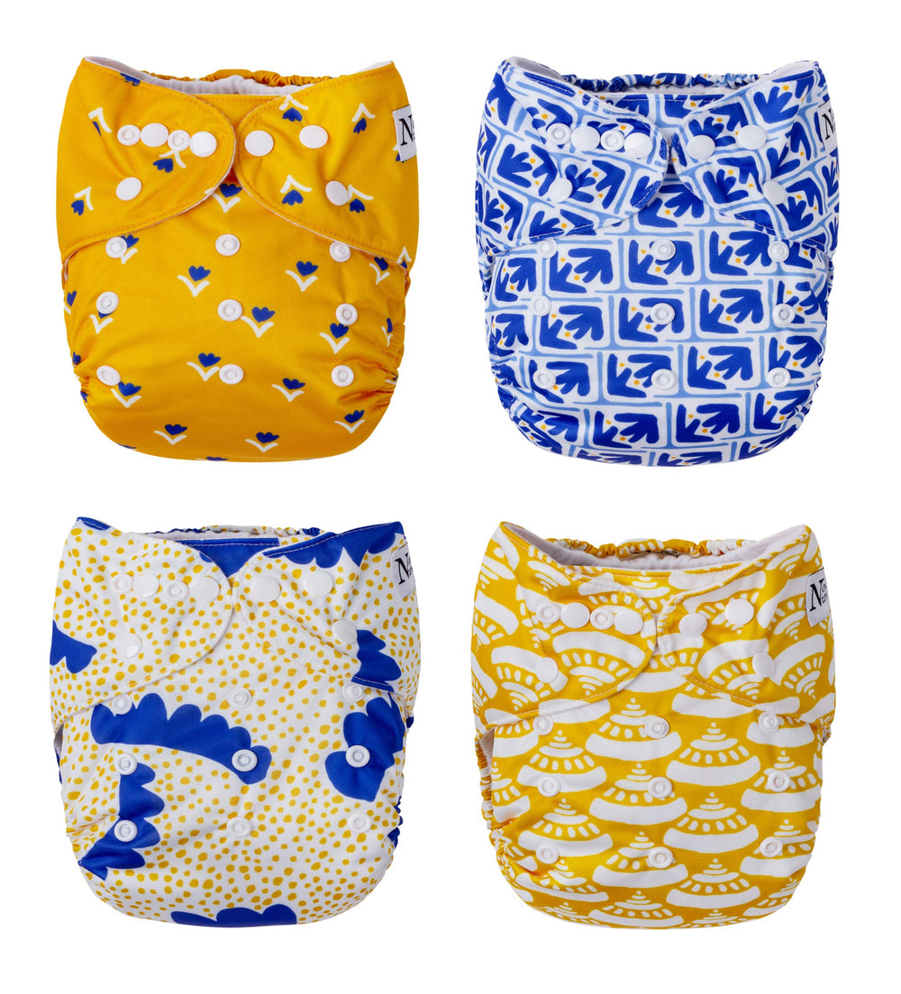 Nora's Nursery cloth pocket diaper 4-pack shows adjustable fit for growing babies.