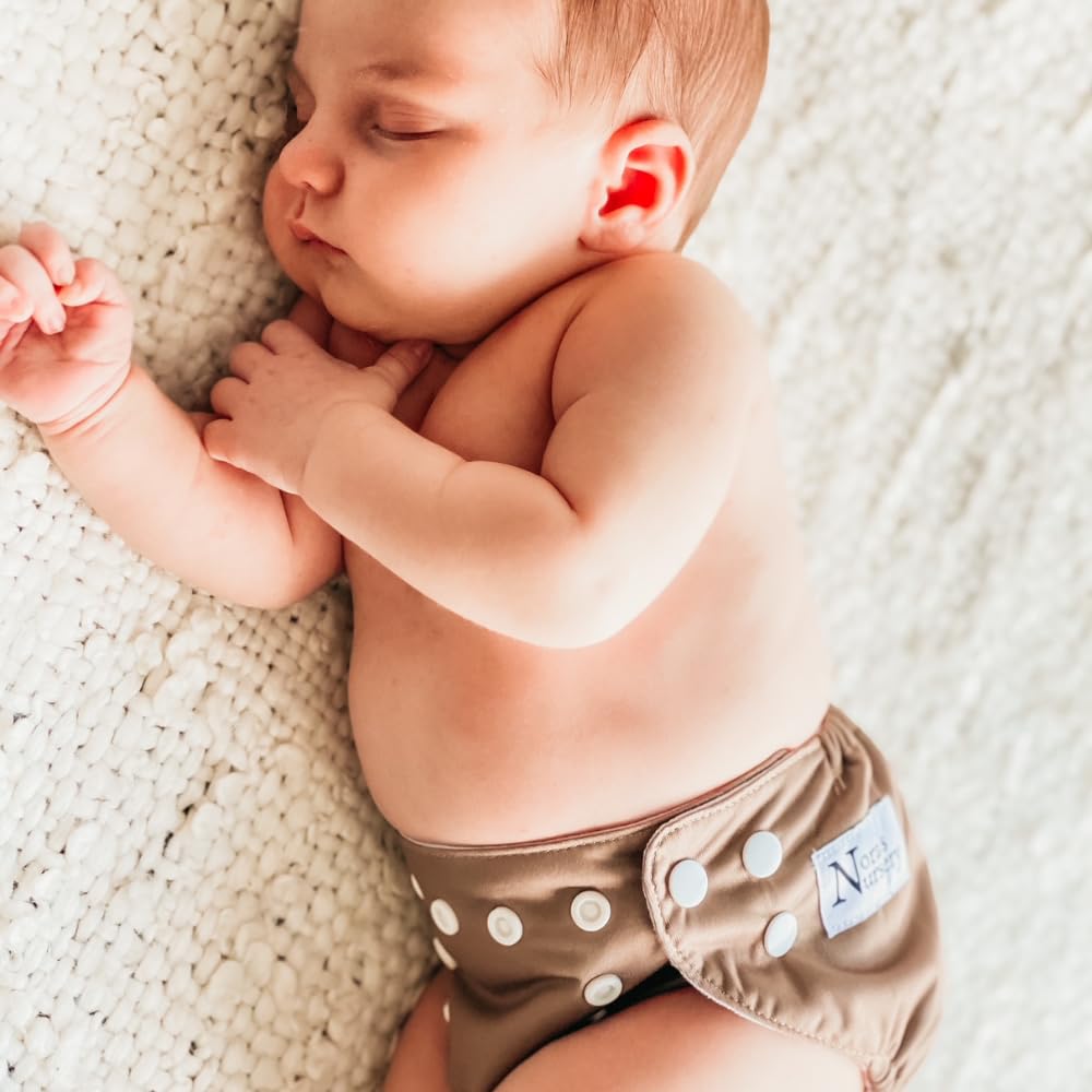 Nora's Nursery diaper pod with detachable strap for travel storage.