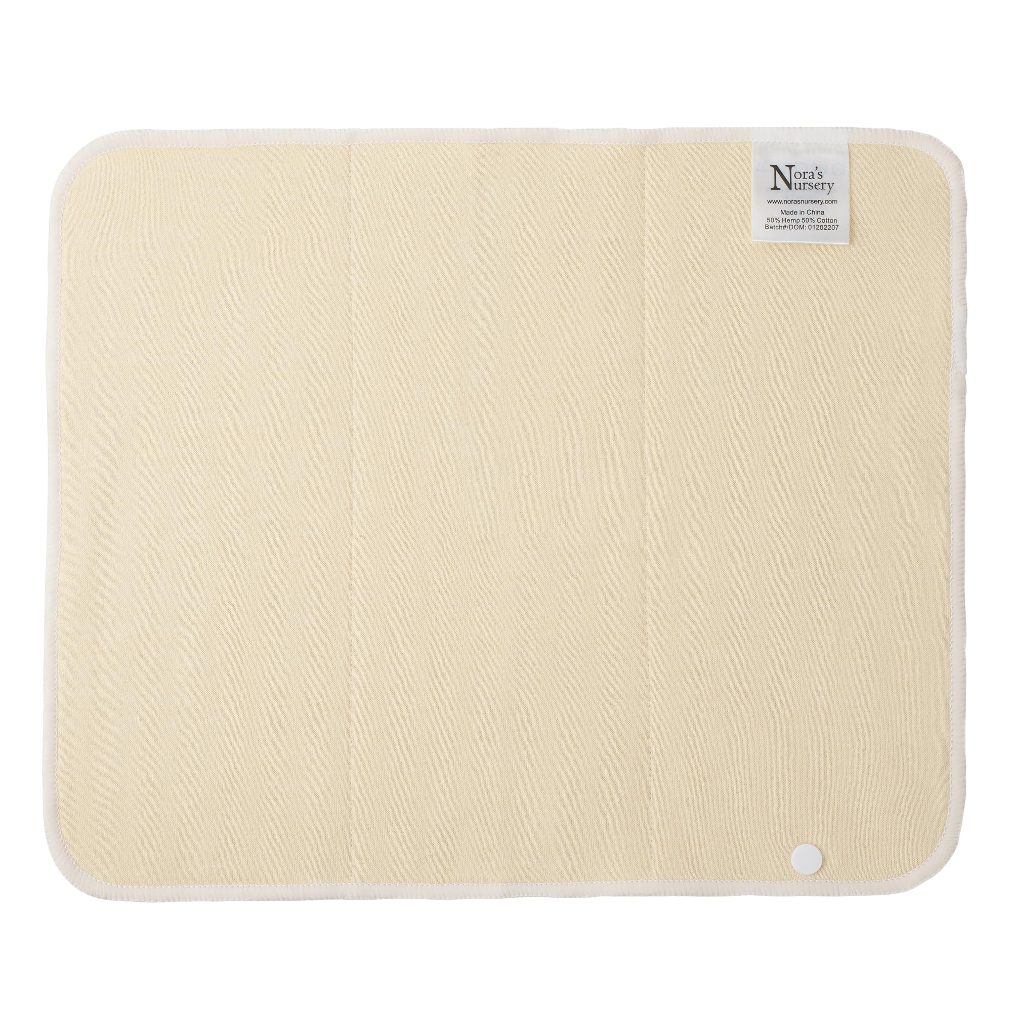 Nora's Nursery hemp prefold snap insert attached to diaper cover with snaps.