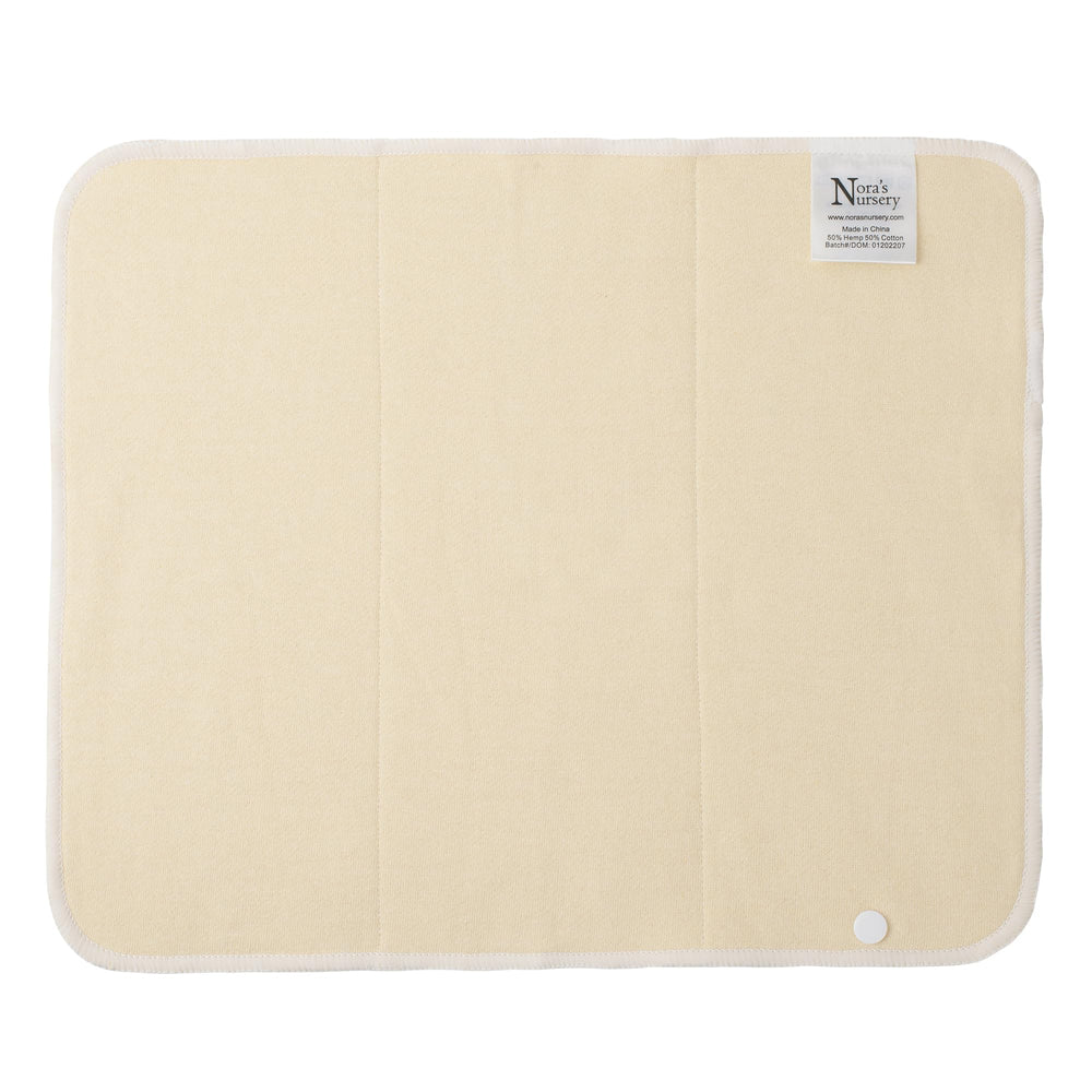 Nora's Nursery hemp prefold snap insert attached to diaper cover with snaps.