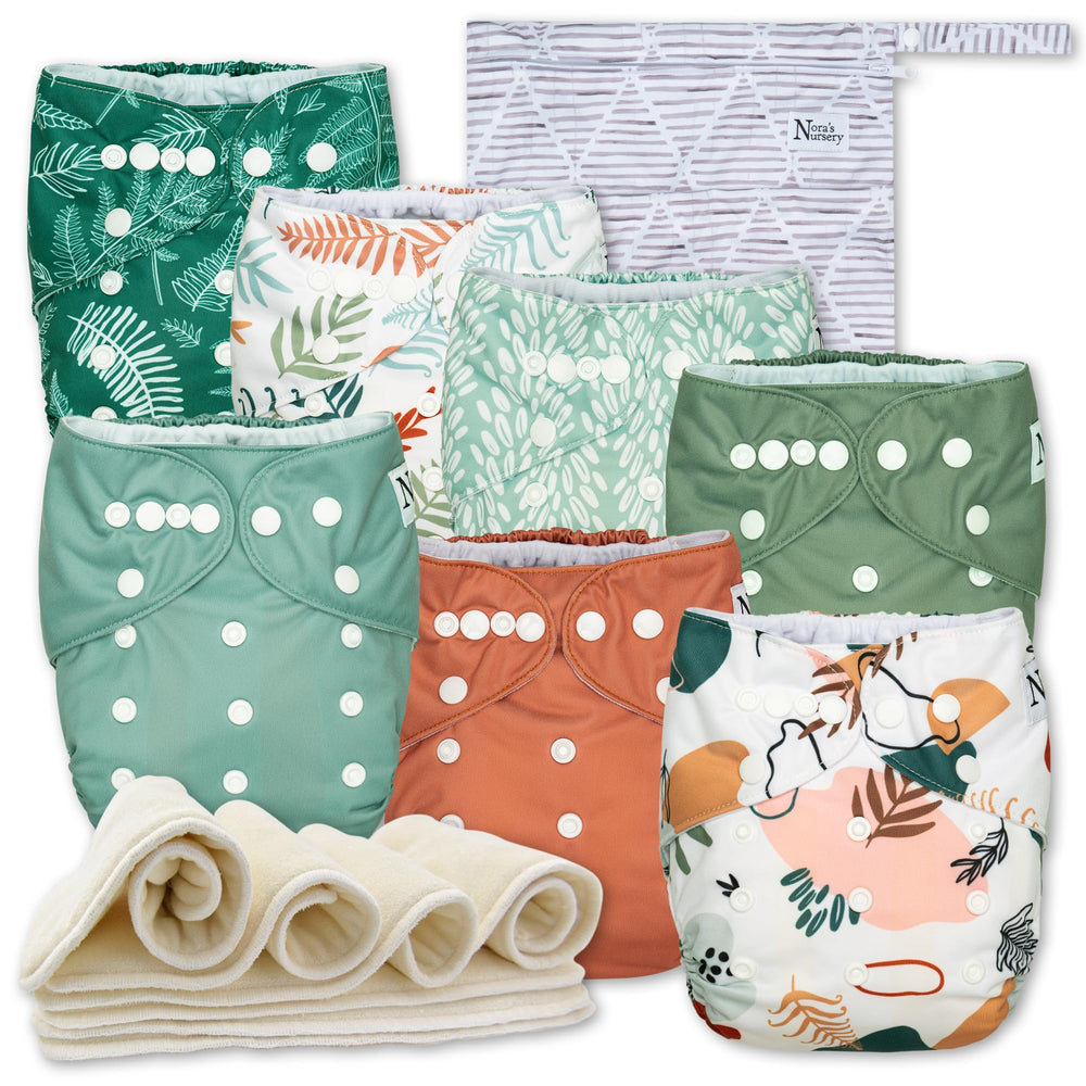 Nora's Nursery Oasis 7-pack diapers laid flat showing adjustable snaps for growing babies.