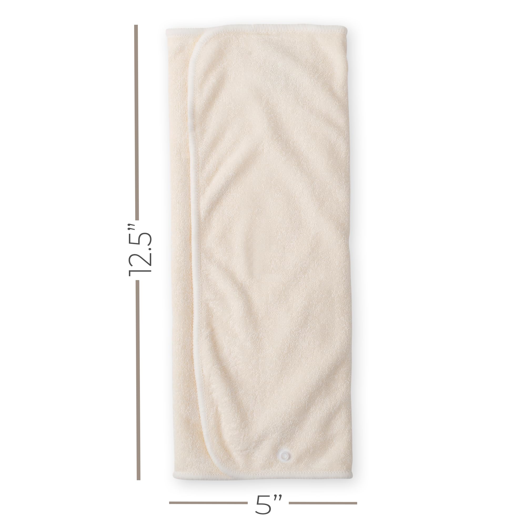 Nora's Nursery prefold inserts snapped to a cover to demonstrate quick attachment.