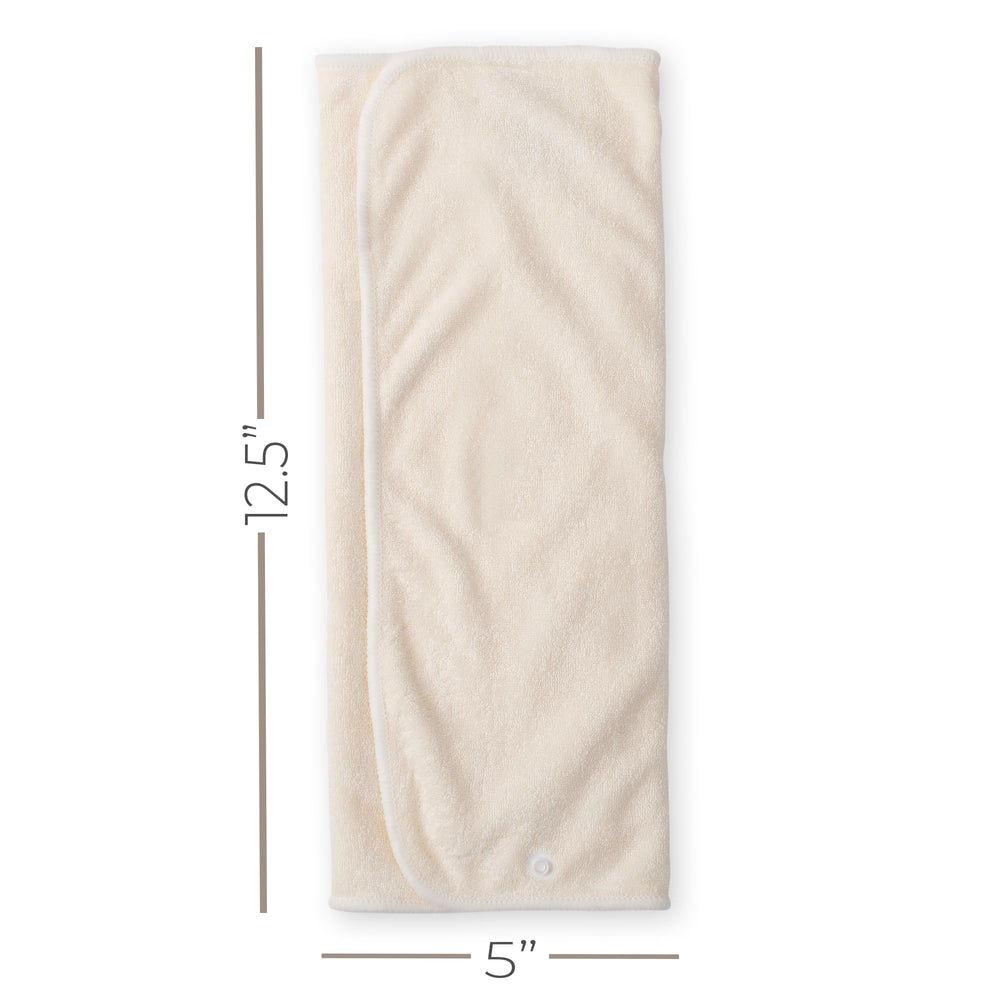Nora's Nursery prefold inserts snapped to a cover to demonstrate quick attachment.