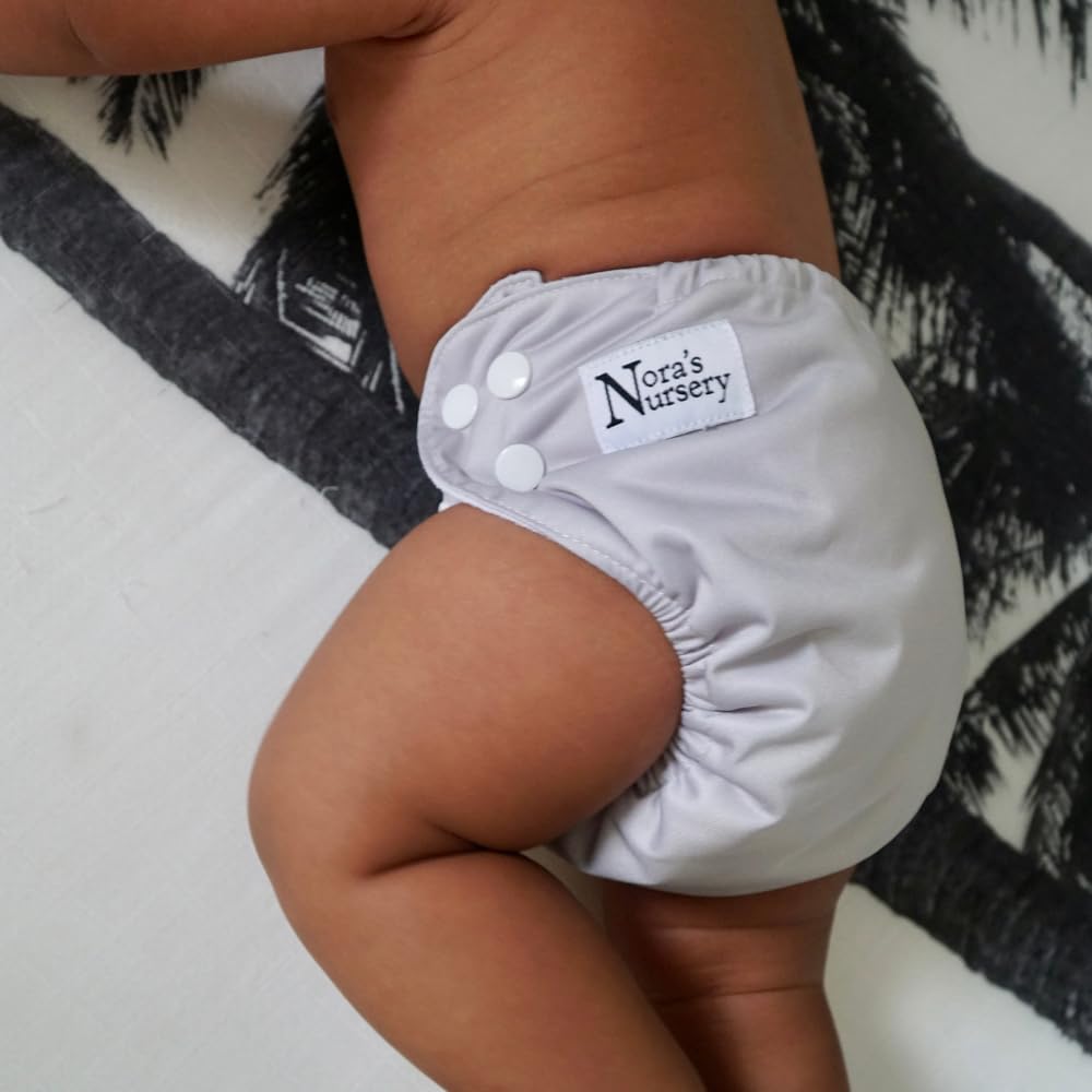 Nora's Nursery reusable cloth diaper promotes comfort and eco-friendly care.
