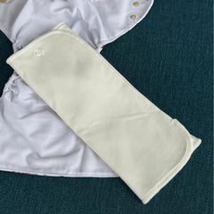 Nora's Nursery soft organic cotton prefolds for gentle skin protection.