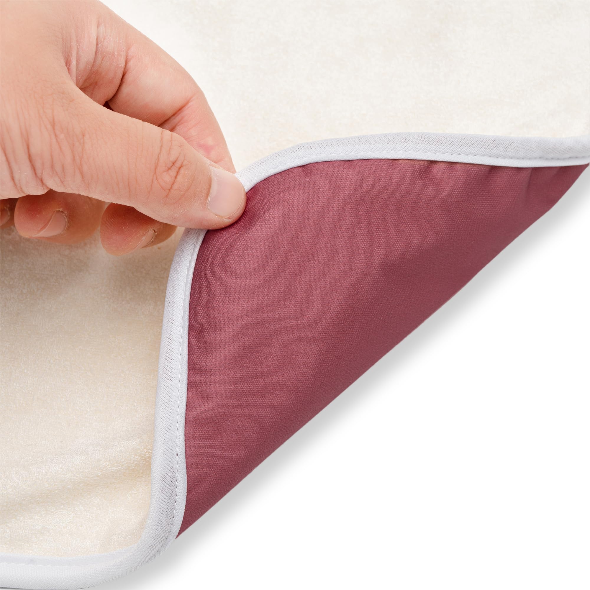Nora's Nursery travel-friendly pad neatly fits in a diaper bag
