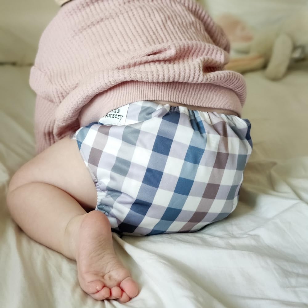 Nora's Nursery winter-waddle-cover keeps baby warm and dry on outings.