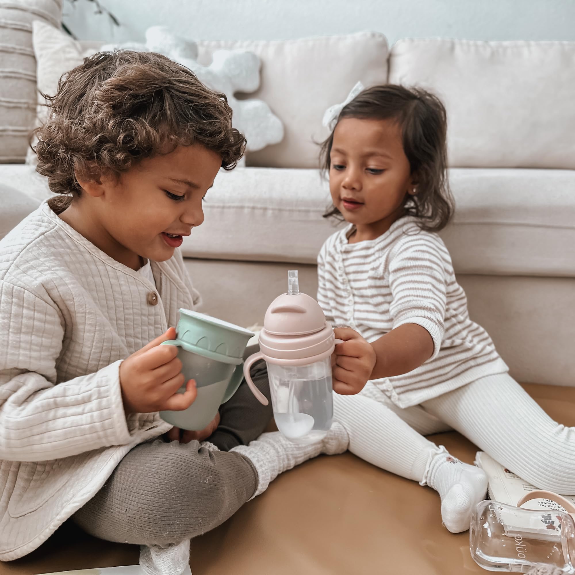 nouka ergonomic grip supports little hands during sipping and play