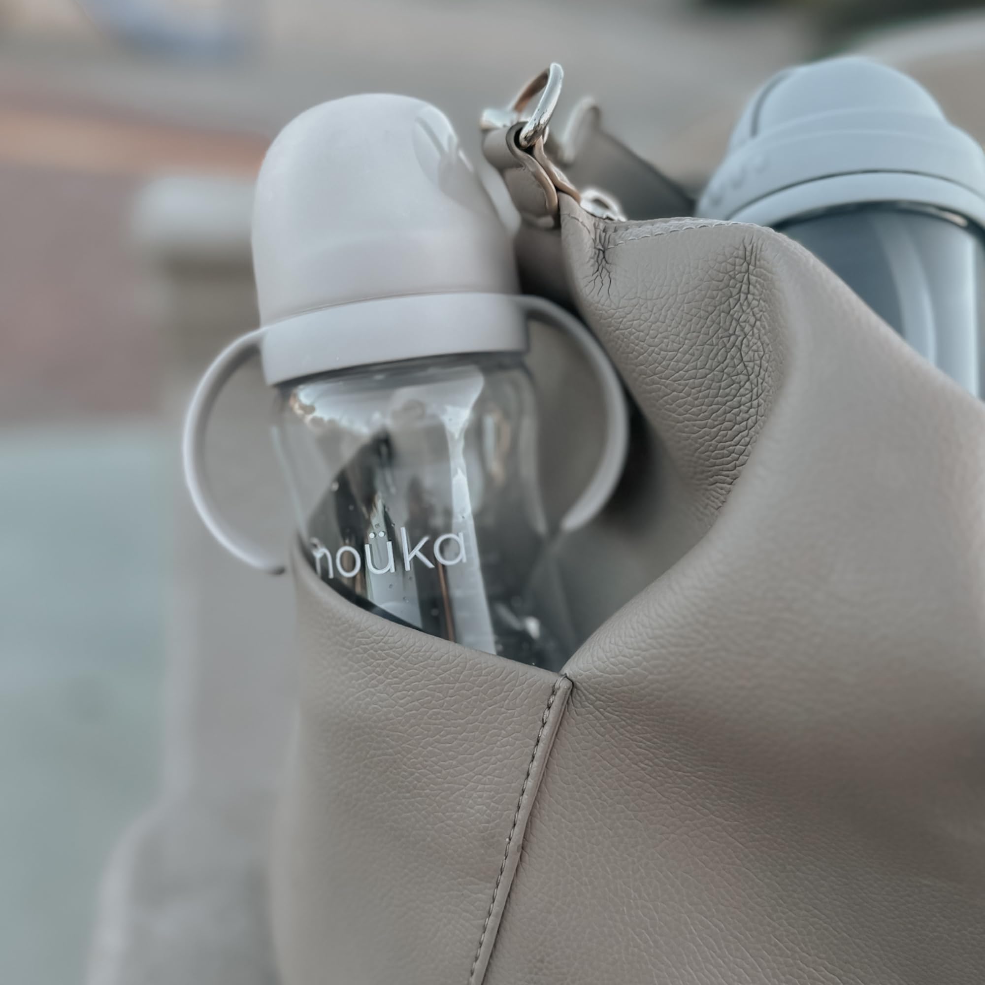 nouka travel lid keeps spout clean on the go.