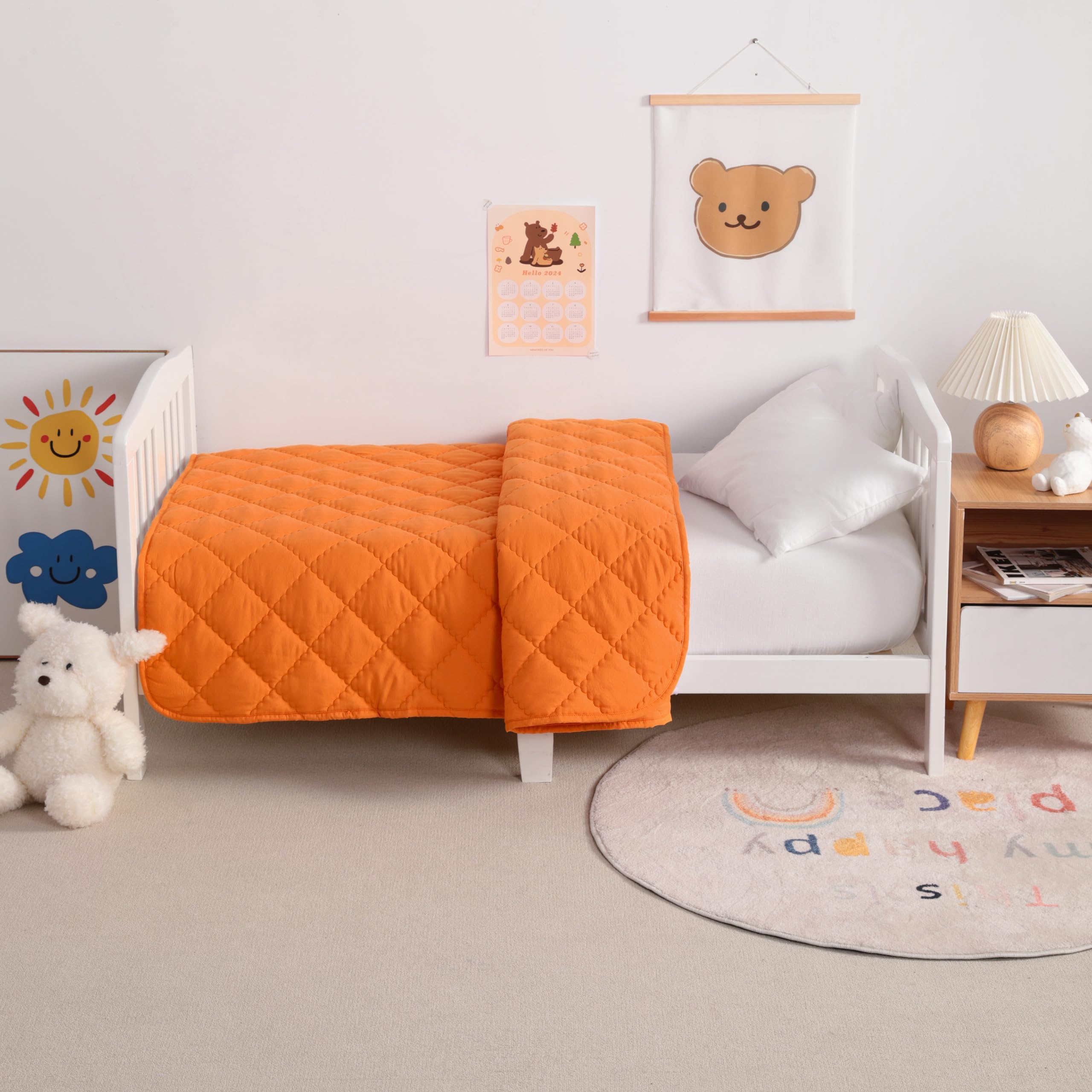 NTBAY down-alternative quilt in orange, easy-care fabric