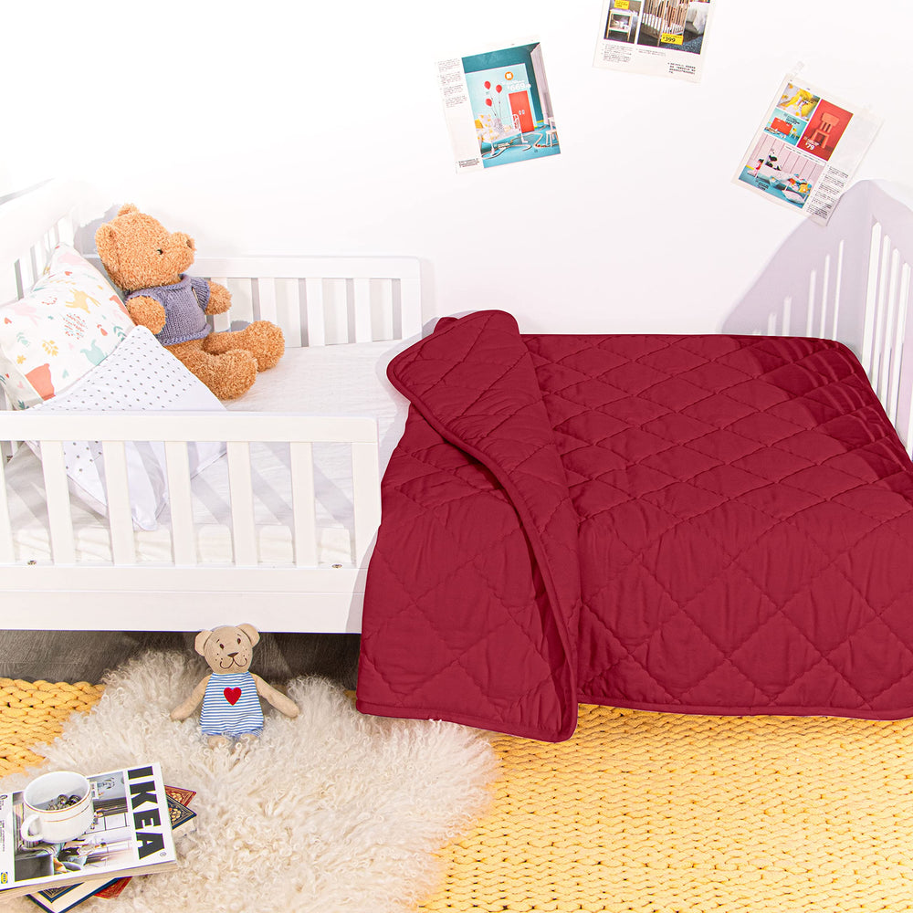 NTBAY Down Alternative Toddler Comforter red crib-use scenario demonstrates versatile nursery warmth.