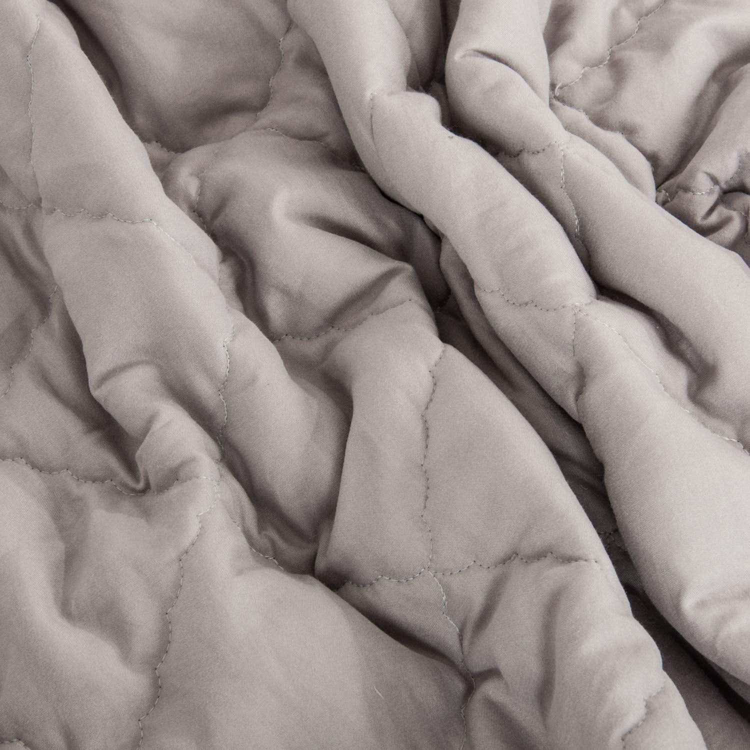 NTBAY comforter in smoke grey color complements modern nurseries.