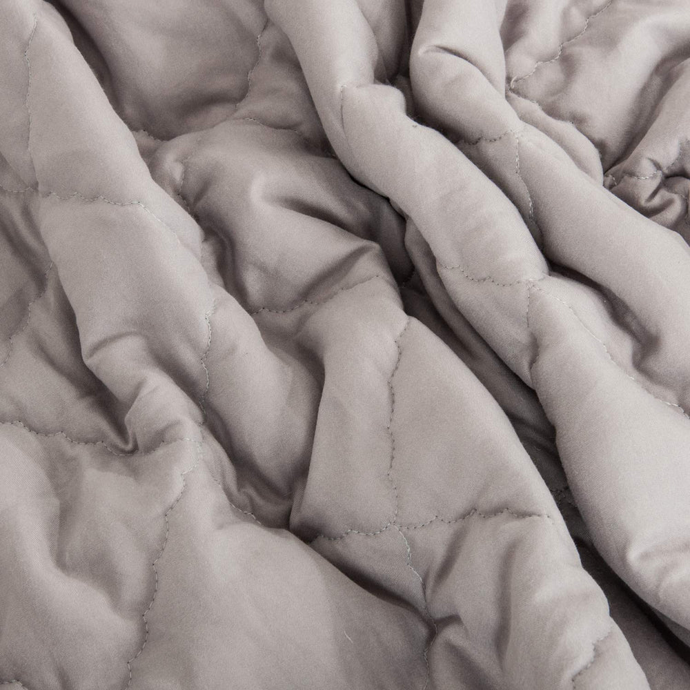 NTBAY comforter in smoke grey color complements modern nurseries.