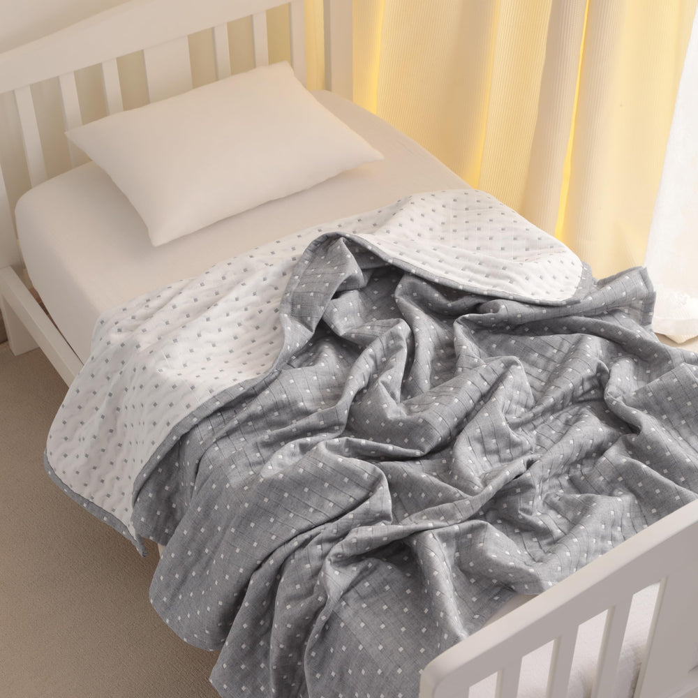 NTBAY grey dot blanket folded for gift-ready decor and baby showers